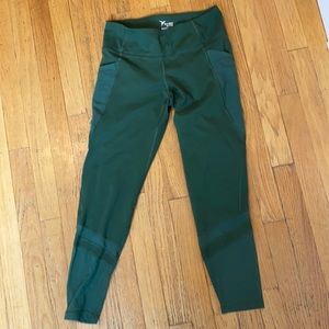 Green leggings with mesh cutouts